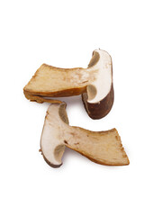 Half-cut mushroom showing interior on white background, fresh edible fungi and culinary ingredient concept
