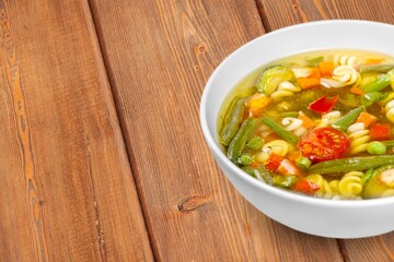 Tasty fresh soup with vegetables on the desk