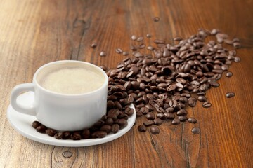 A white cup of hot steaming coffee drink