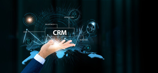 Businessman hold CRM words and growth technology and data connection. Client retention, marketing automation, sales analytics, digital engagement.
