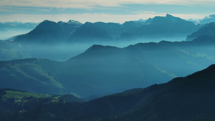 Fototapeta premium Aerial view of mountains under mist morning