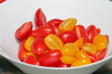 Fresh Red and Yellow Grape Tomatoes in a White Bowl
