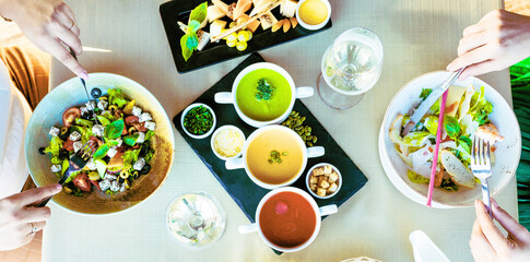 Delicious fresh Easter eggs on a wooden table and in a basket make a tasty snack