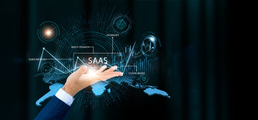Businessman hold SaaS words and growth technology and data connection. Cloud software, subscription platform, digital solution, online management.