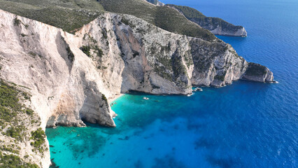 Aerial drone photo of famous steep rocky white cliffs creating beautiful coves and turquiose sea...