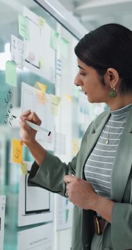 Glass wall, business woman and writing for ux design, ui layout and interface planning. Creative person, documents and office notes with wireframe for user experience, app template and display ideas