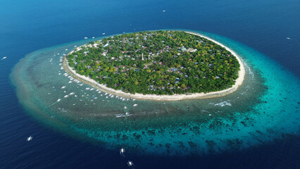 Tropical island with turquoise water and coral reef