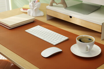 Stylish workplace with brown mat on desk in office, closeup