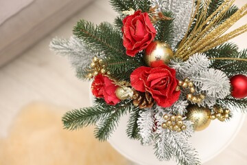 Beautiful composition with fir tree branches indoors, closeup