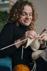 Naklejka premium The Joyful Knitter is truly Engrossed in a Delightful Creative Hobby Session of Knitting