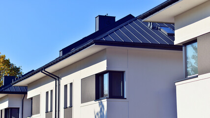 Newly built terraced houses in a residential area. Modern terraced houses on the outskirts of the city.