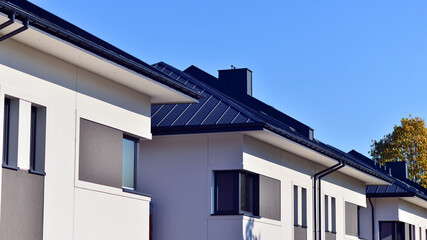Newly built terraced houses in a residential area. Modern terraced houses on the outskirts of the city.