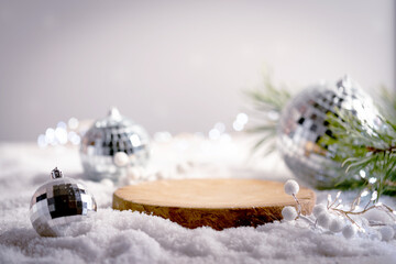Winter Christmas composition with geometric shapes podiums and christmas decorations in snow. Empty...