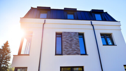 Newly built terraced houses in a residential area. Modern terraced houses on the outskirts of the city.