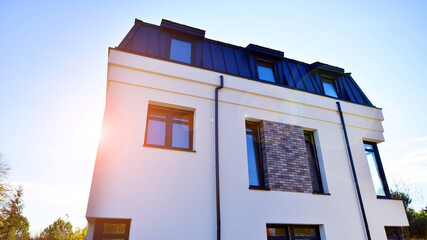 Newly built terraced houses in a residential area. Modern terraced houses on the outskirts of the city.