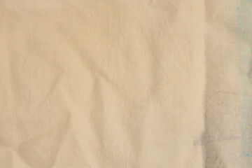Grunge beige dirty canvas fabric. Dirty stain grain texture abstract background.