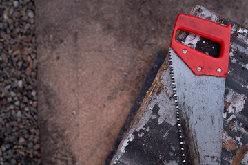 Hand saw with red handle top view