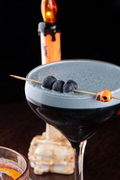 close up of morticia adams halloween themed cocktail