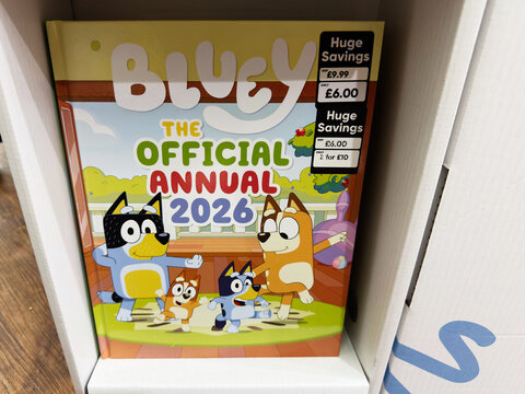 Bluey official annual 2026 cover featuring family and friends in colorful cartoon illustration