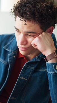 Bored, employee and man in office, tired and journalist with low energy, think and unhappy with job. Frustrated, reporter and person with burnout in newsroom, reflection and lazy with exhaustion