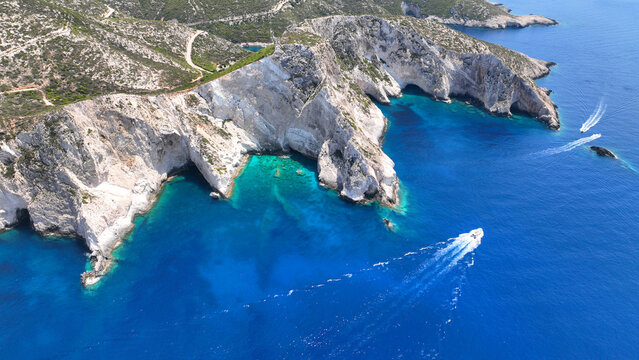 Aerial drone photo of white beach consisting of volcanic caves and white steep hill near famous shipwreck cove a wonder of nature, Zakinthos island, Ionian, Greece