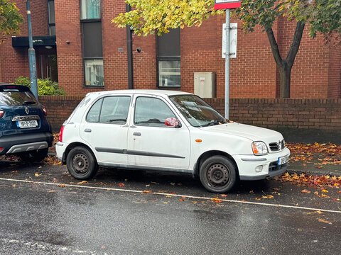 Dublin, Ireland - October 19, 2025: White second-generation Nissan Micra K11 parked in a public parking lot.