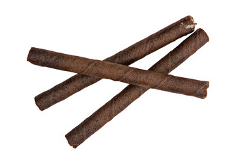 stack of three chocolate wafer rolls isolated against a transparent background