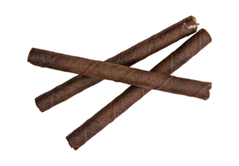 stack of three chocolate wafer rolls isolated against a transparent background