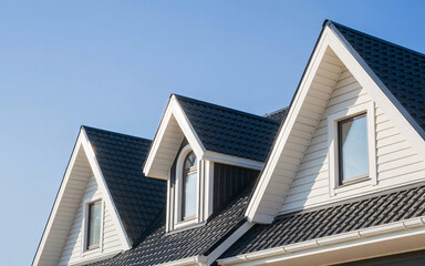 Obraz premium House Roof with Dormer Windows and Dark Shingles | Exterior Architecture for Real Estate Marketing