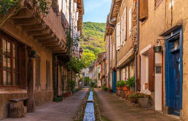 Narrow street in Durfort, in the Black Mountains, in the Tarn department, Occitanie region, France.