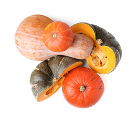 Whole and cut pumpkins isolated on white, top view. Gourd family © New Africa