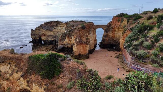 Aerial view of Praia do Camilo revealing stunning rock formations and a picturesque beach Algarve Portugal