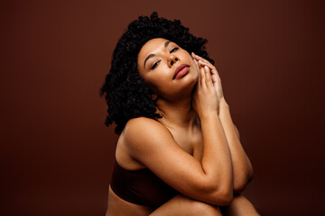 Fototapeta premium Tender portrait of a confident woman embracing self-acceptance with natural beauty