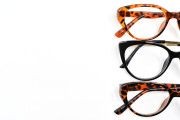 Front view of a selection of pretty wonen's glasses with isolated on a plain white background. Copy space. No people.