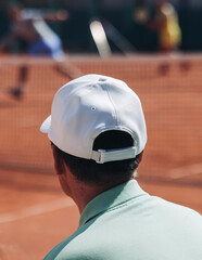 Tennis tournament championship on outdoor clay court with net, professional athletes play in motion...