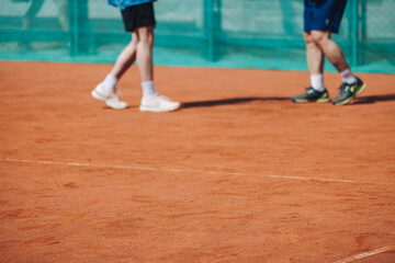 Tennis tournament championship on outdoor clay court with net, professional athletes play in motion...