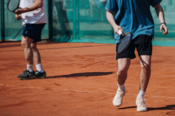 Tennis tournament championship on outdoor clay court with net, professional athletes play in motion...