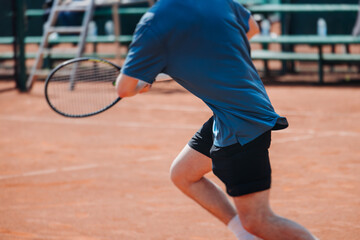 Tennis tournament championship on outdoor clay court with net, professional athletes play in motion with rackets serve tennis ball during tennis match game, tennis training in a sunny day on a stadium