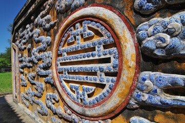 Decorated window in the Imperial City, the  walled enclosure within the citadel of the city of Hue, the former imperial capital of Vietnam.
