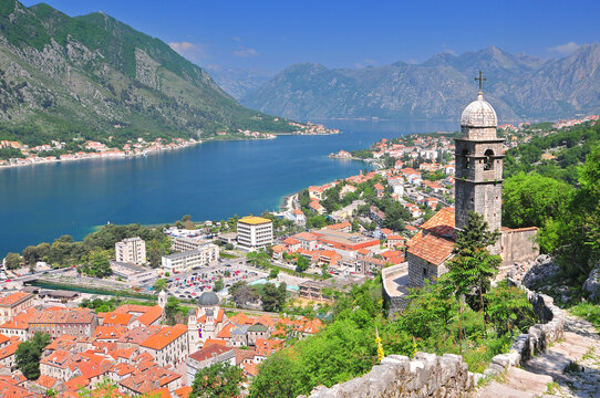 Bell tower of Church Our Lady of Remedy on the hill tower in the old city of Kotor and the Kotor Bay in Montenegro.