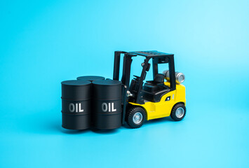 A loader with oil barrels. Oil storage and logistics. Fuel storage facilities. Fuel for industry. Petroleum trade, and energy supply management. Energy markets, global fuel economy