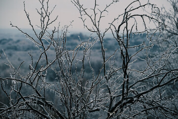 Texas ice in winter cold weather with hills in background.