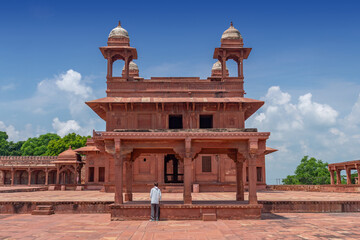 Diwan E Khas, also known as the Hall of Private Audiences, with an ornately carved central stone pillar, built for Emperor Akbar in Fatehpur Sikri, India.
