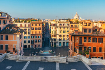 View from the top of the Spanish Steps overlooking Piazza di Spagna with fountain and historic buildings, Rome city, Italy. Italian architecture. Popular travel and touristic destination in Europe