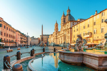 Piazza Navona with Fountain of Neptune, Baroque church of Sant'Agnese in Agone and ancient Egyptian obelisk in Rome, Italy at sunrise. Fontana del Nettuno on Italian square. Travel destination
