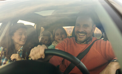 Family takes a sunny scenic drive in car
