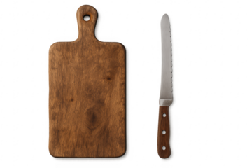 Wooden cutting board sitting next to a serrated bread knife