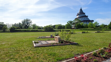 The Millennium Tower (Jahrtausendturm) in Magdeburg, Germany, surrounded by parkland and pathways,...