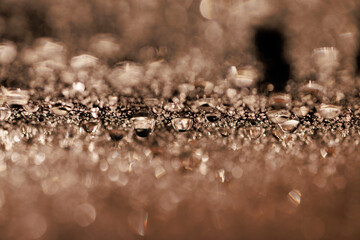 macro close-up of water droplets on a dark background. Mockup for your logo. horizontal wallpaper or web banner.