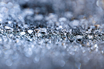 macro close-up of water droplets on a dark background. Mockup for your logo. horizontal wallpaper or web banner.